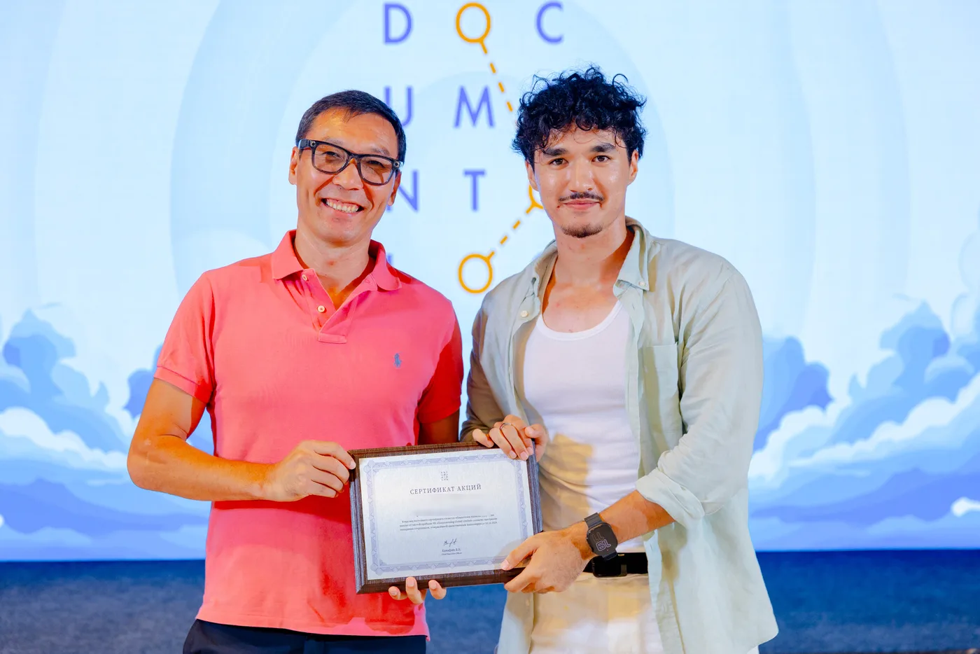 Handing over a share certificate at the Documentolog team offsite, 18 July 2026